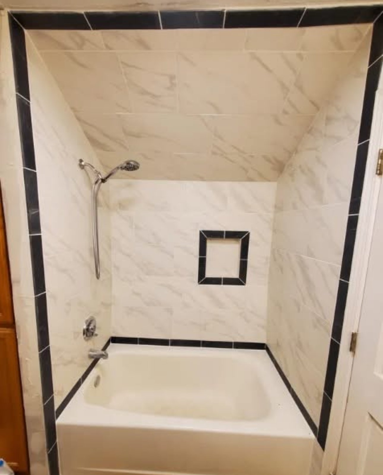 Tub shower black white marble tile South Louisiana